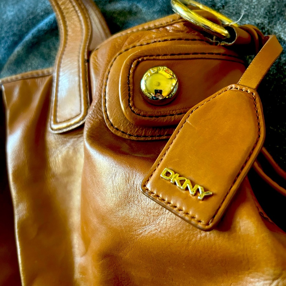 Brown Leather DKNY 2008 Handbag with Purple Lining.